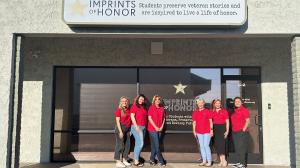 staff in front of building